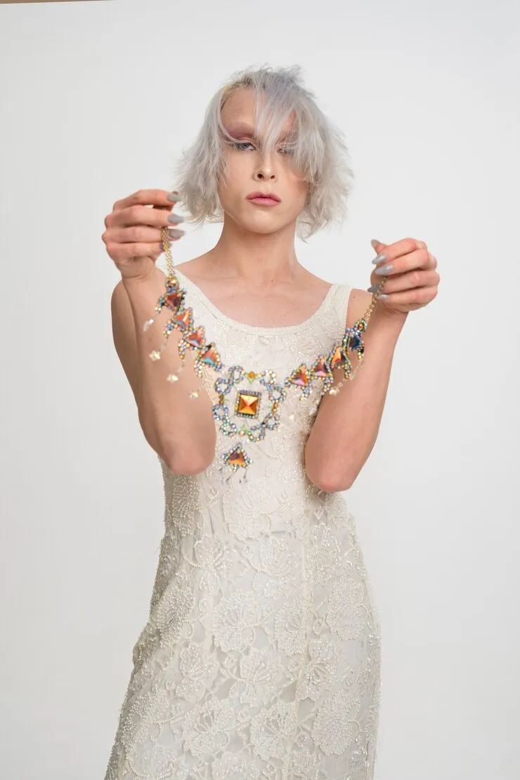 medium-shot-drag-queen-holding-necklace_23-2149247330_result